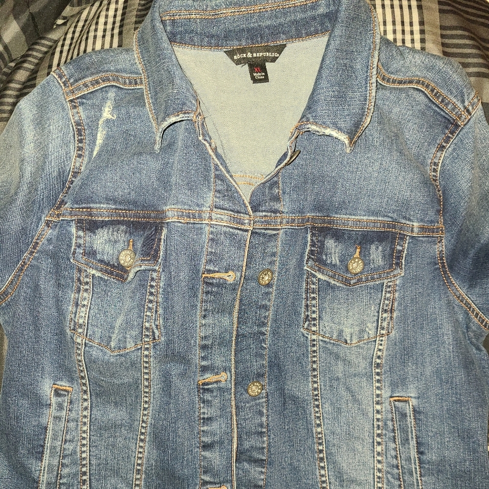 Distressed denim jacket